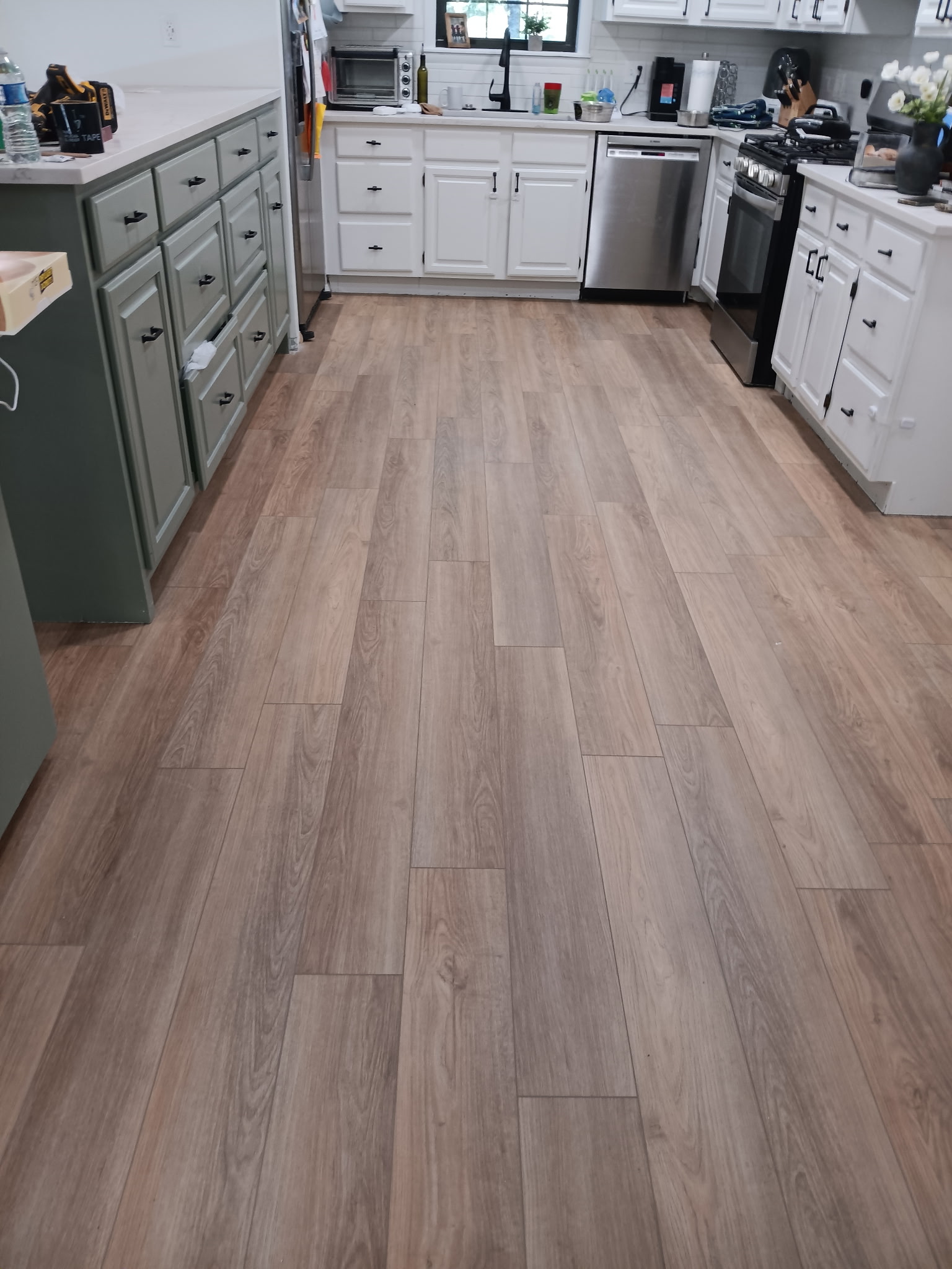 Wood-look flooring installed through a residential kitchen